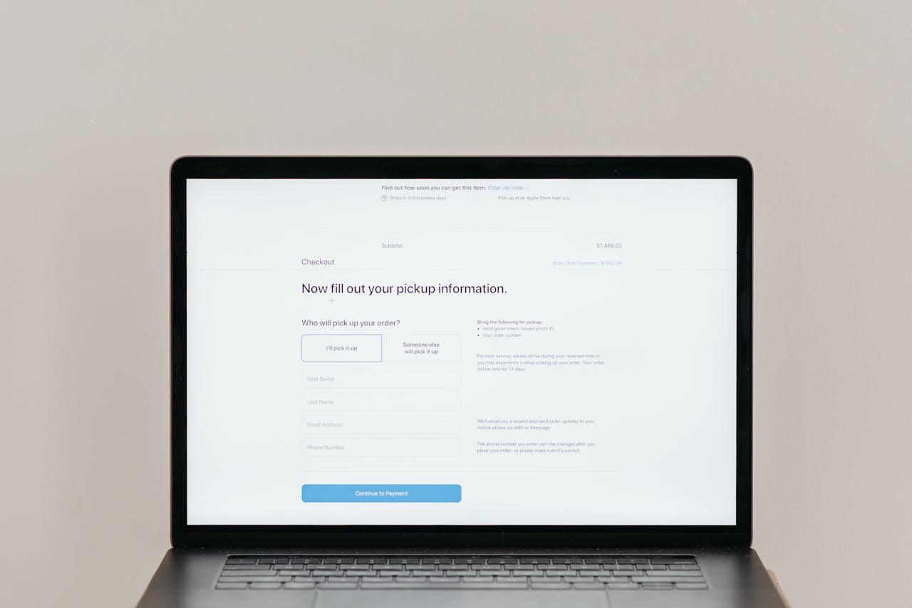 A laptop displaying an online checkout form, highlighting technology and e-commerce.